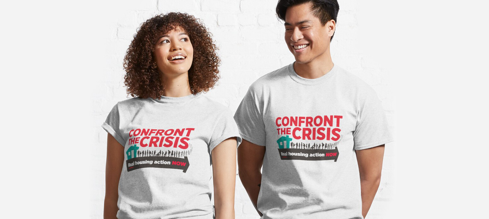 Two people dressed in Confront the Crisis T-shirts